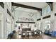 Bright living room with high ceilings, a decorative chandelier, and a view of the open kitchen at 1024 Prosperity Dr, Winter Garden, FL 34787