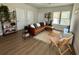 Cozy living room with a leather sofa, modern decor, and ample natural light at 1024 Prosperity Dr, Winter Garden, FL 34787