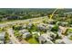 Scenic aerial view showcasing the community, landscaping, pool, and convenient access to nearby roadways at 110 Scottsdale Sq # 110, Winter Park, FL 32792