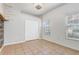 Bright bedroom boasts tile floors, a ceiling fan, and a double door closet at 13046 Island Breeze Ct, Orlando, FL 32824