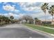 Main community entrance with trees and a sign at 13046 Island Breeze Ct, Orlando, FL 32824