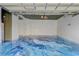 Spacious garage with epoxy floor coating and white walls at 13046 Island Breeze Ct, Orlando, FL 32824