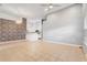 Spacious open living room with tile floors and contemporary lighting leading into the kitchen at 13046 Island Breeze Ct, Orlando, FL 32824