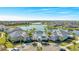 Aerial view of community center with pool, lake view and ample parking at 13348 Panama Beach Ct, Orlando, FL 32827
