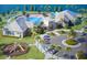 Aerial view of community clubhouse, pool, playground and surrounding landscape at 13348 Panama Beach Ct, Orlando, FL 32827