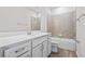 Bright bathroom featuring a white vanity, tile floors, and a shower/tub combo at 13348 Panama Beach Ct, Orlando, FL 32827