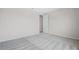 Spacious bedroom with neutral carpet and walls, featuring a doorway entrance at 13348 Panama Beach Ct, Orlando, FL 32827