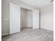 Bedroom featuring wood-look floors and an accessible closet at 13348 Panama Beach Ct, Orlando, FL 32827