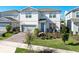 Charming two-story home featuring a well-manicured front yard and a two-car garage at 13348 Panama Beach Ct, Orlando, FL 32827