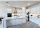 Modern kitchen with stainless appliances, white cabinets, and large island at 13348 Panama Beach Ct, Orlando, FL 32827