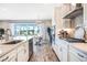 Spacious kitchen featuring stainless steel appliances and an island with a sink at 13348 Panama Beach Ct, Orlando, FL 32827