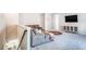 Cozy upstairs living area with comfortable seating, a TV, and access to the kitchen at 13348 Panama Beach Ct, Orlando, FL 32827