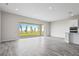 Bright, open living area featuring sliding glass doors to the outdoor patio at 13348 Panama Beach Ct, Orlando, FL 32827