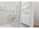 Modern tiled shower with decorative accents and modern fixtures in a neutral bathroom at 13348 Panama Beach Ct, Orlando, FL 32827