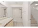 Bright bathroom featuring a tub with a shower, tile flooring, and a neutral color palette at 15 Silver Park Cir, Kissimmee, FL 34743