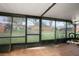 View of the screened in back porch with tile floors at 15 Silver Park Cir, Kissimmee, FL 34743