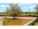 Large, fenced backyard with mature trees and green space at 15848 Autumn Glen Ave, Clermont, FL 34714