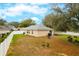 Spacious backyard with patio area and fenced perimeter at 15848 Autumn Glen Ave, Clermont, FL 34714