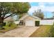 Inviting single-story home featuring a well-kept lawn and an attached one car garage at 15848 Autumn Glen Ave, Clermont, FL 34714