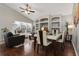 Spacious living room and dining area featuring vaulted ceilings and wood floors at 15848 Autumn Glen Ave, Clermont, FL 34714