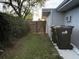 Backyard featuring a wooden fence and mature trees that offer shade at 161 Randia Dr, Orlando, FL 32807