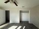 Spacious bedroom featuring a walk-in closet and neutral walls at 161 Randia Dr, Orlando, FL 32807