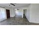 Spacious living area with light-colored walls and hard surface floors, flowing into adjacent spaces at 161 Randia Dr, Orlando, FL 32807