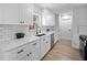 Beautiful, bright kitchen featuring white cabinets and stainless steel appliances at 1625 Victory Palm Dr, Edgewater, FL 32132