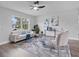 Modern living room featuring a comfortable sofa, stylish decor, light-colored wood floors, and natural light at 1625 Victory Palm Dr, Edgewater, FL 32132