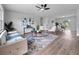 Bright living room featuring contemporary decor, stylish furniture, and a light-colored wood floor at 1625 Victory Palm Dr, Edgewater, FL 32132