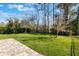 Expansive backyard with lush green grass, a sturdy fence, and beautiful mature trees at 168 Victoria Oaks Blvd, Deland, FL 32724