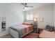 Cozy bedroom featuring a full-size bed, decorative wall art, a ceiling fan and natural light at 168 Victoria Oaks Blvd, Deland, FL 32724