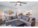 Spacious living room flowing into a modern kitchen with stainless steel appliances and granite countertops at 168 Victoria Oaks Blvd, Deland, FL 32724