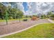 Community playground featuring a swing set, climbing structure, and seating at 168 Victoria Oaks Blvd, Deland, FL 32724