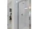 Bathroom showcasing a modern glass-enclosed shower with white subway tile and contemporary fixtures at 1713 Delightful Dr, Davenport, FL 33896