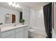 Modern bathroom featuring a single vanity with quartz countertop and a bathtub/shower combination at 1713 Delightful Dr, Davenport, FL 33896