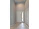 Inviting entryway with neutral walls, tile flooring and a coat closet at 17343 Summer Oak Ln, Clermont, FL 34711