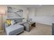 Bright living room featuring a comfortable gray sofa with yellow accent pillows and a modern coffee table at 1865 Walnut Creek Dr, Kissimmee, FL 34744