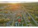 Scenic aerial view of a quiet neighborhood with lush trees and well-kept homes under a bright sky at 1879 Grey Fox Dr, Lakeland, FL 33810