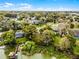 Scenic aerial shot of a neighborhood, highlighting the property's proximity to the waterfront at 1890 Twin Lake Dr, Gotha, FL 34734