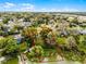 Aerial view of a waterfront property, showcasing its desirable location and surrounding greenery at 1890 Twin Lake Dr, Gotha, FL 34734