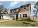 Charming two-story home featuring a well-manicured lawn and a neutral color palette at 204 Pinecrest Rd, Mount Dora, FL 32757