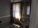 Bathroom with a white sink, mirror, and tub with a shower curtain at 204 S Center St, Eustis, FL 32726