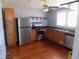 Well-equipped kitchen features stainless steel appliances and wood cabinets at 204 S Center St, Eustis, FL 32726