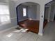 Sunlit living room features hardwood floors and neutral walls at 204 S Center St, Eustis, FL 32726