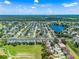 Aerial view of neighborhood near lake showcasing community and green spaces at 20648 Maxim Pkwy Pkwy, Orlando, FL 32833