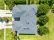 Aerial view of townhome community showcasing roof lines, driveways, and landscaping at 20648 Maxim Pkwy Pkwy, Orlando, FL 32833