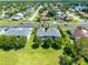 Aerial view of a residential area showcases well-maintained lawns and mature trees at 20648 Maxim Pkwy Pkwy, Orlando, FL 32833