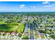 Expansive aerial view of a neighborhood with lush greenery and a golf course at 20648 Maxim Pkwy Pkwy, Orlando, FL 32833