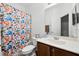 The bathroom features a colorful shower curtain and modern vanity, and a built-in mirror at 20648 Maxim Pkwy Pkwy, Orlando, FL 32833